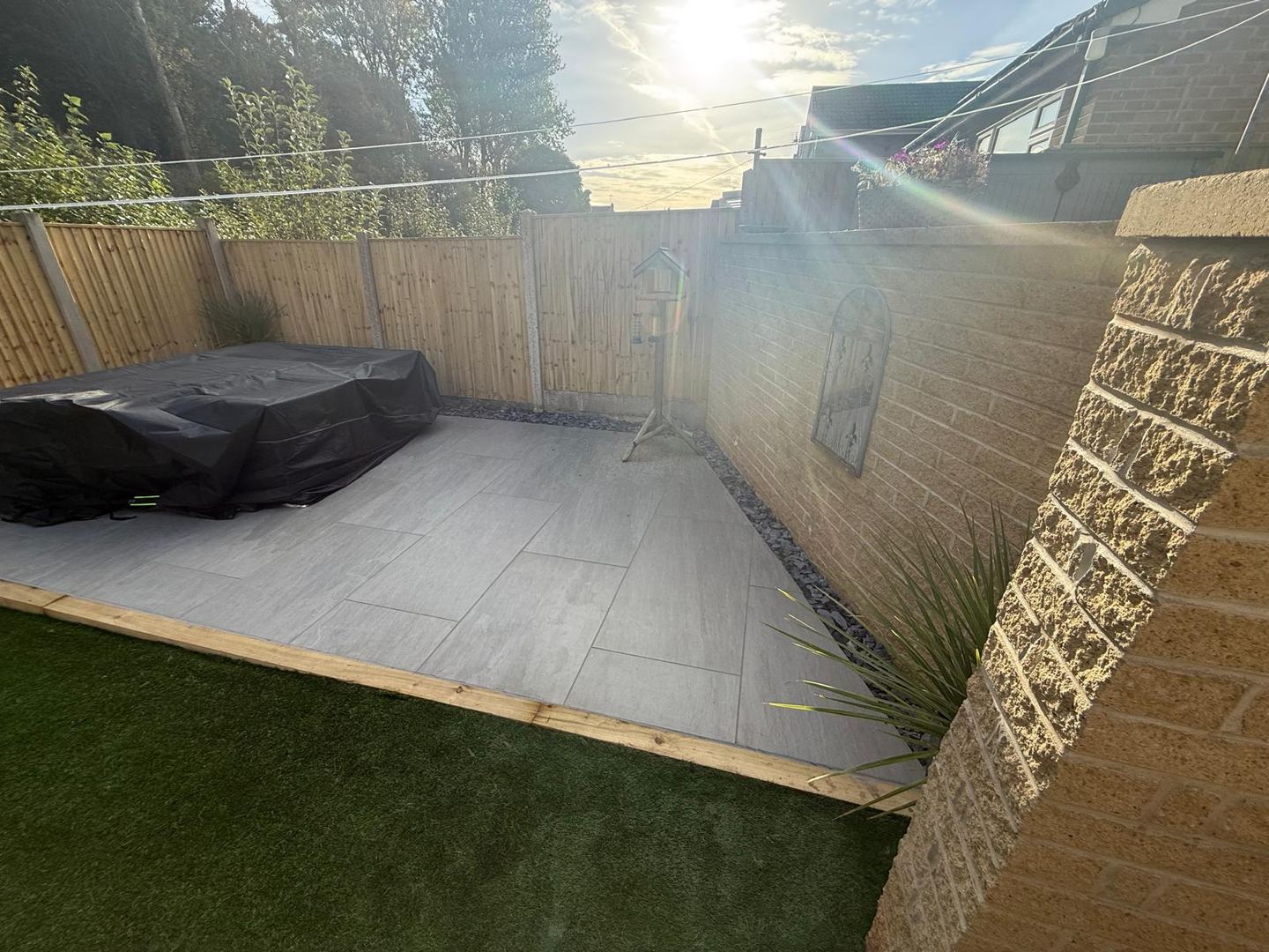 Grey tiled patio installed as part of a Nottingham garden project