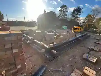 Facing brickwork started above the garage foundations by Hardy and Sons
