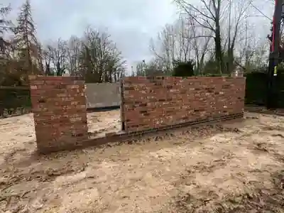 Garage openings formed within the cavity wall construction