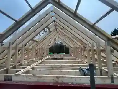 Timber roof frame taking shape across the garage build