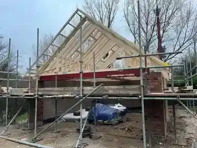Roof trusses and structural steelwork on the new brick garage