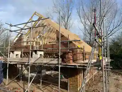 Brick garage walls and timber roof structure in progress