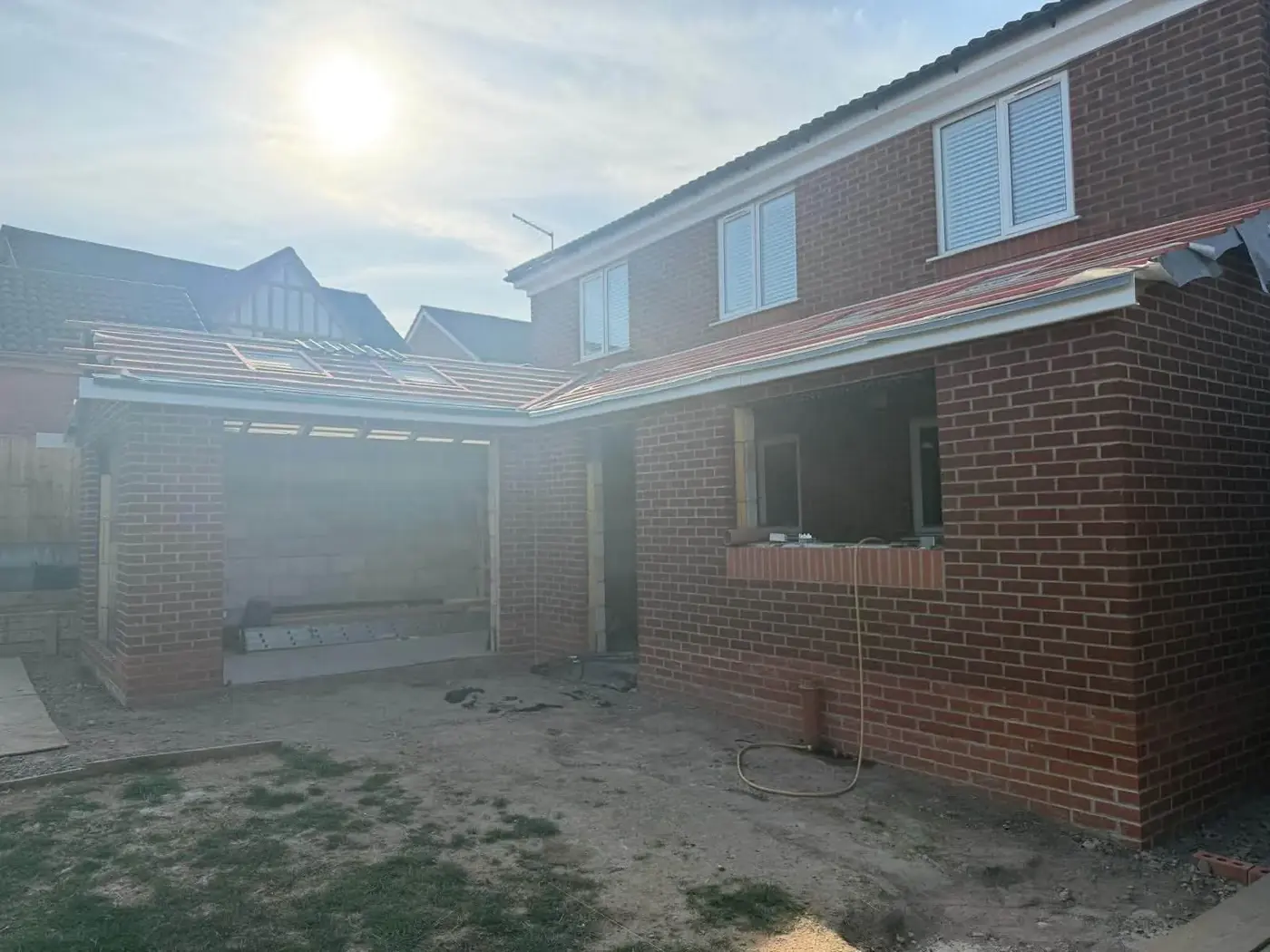Rear home extension with new brickwork, structural openings and roof preparation