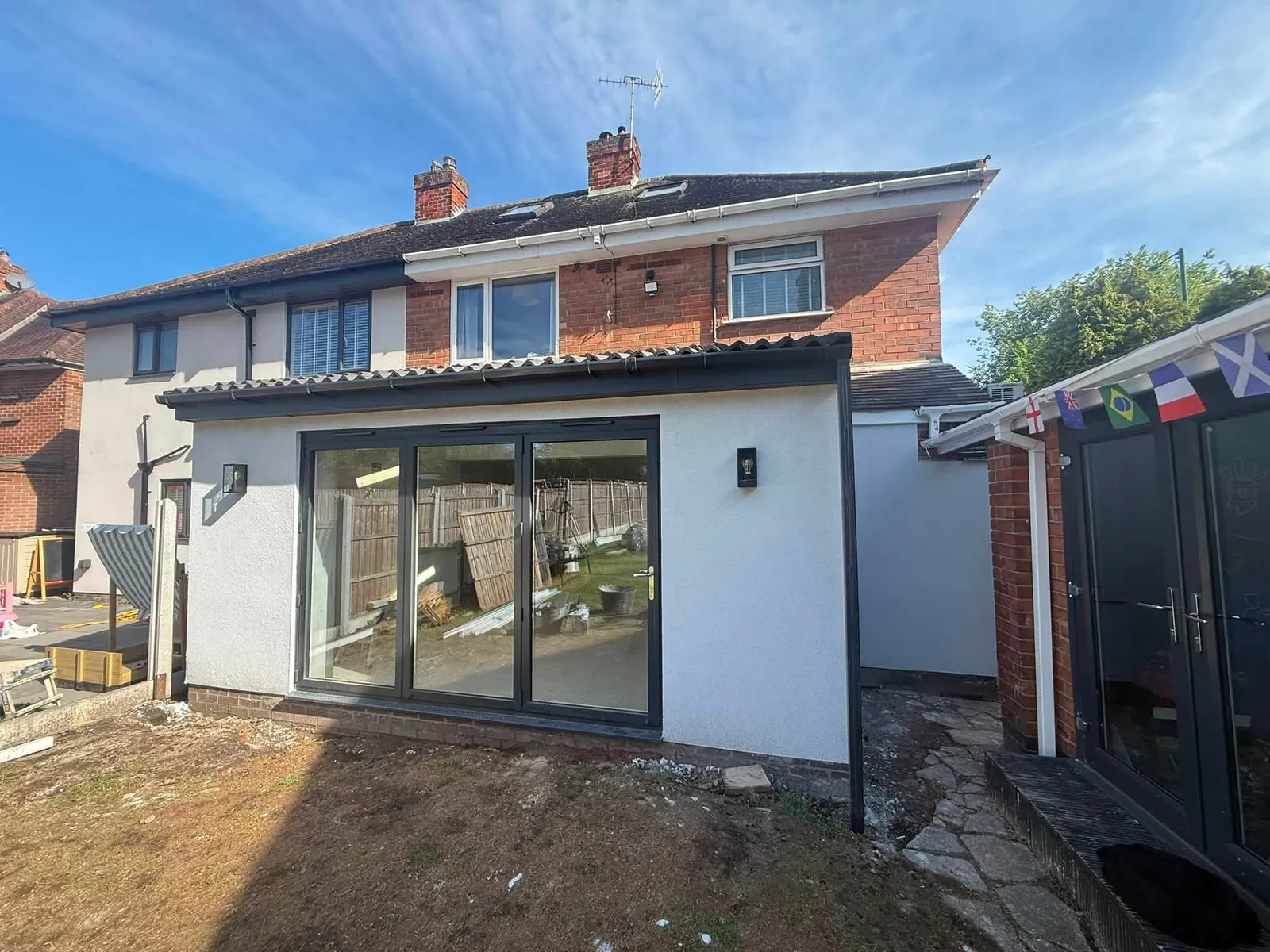Completed Sherwood extension exterior with new rear doors by Hardy and Sons